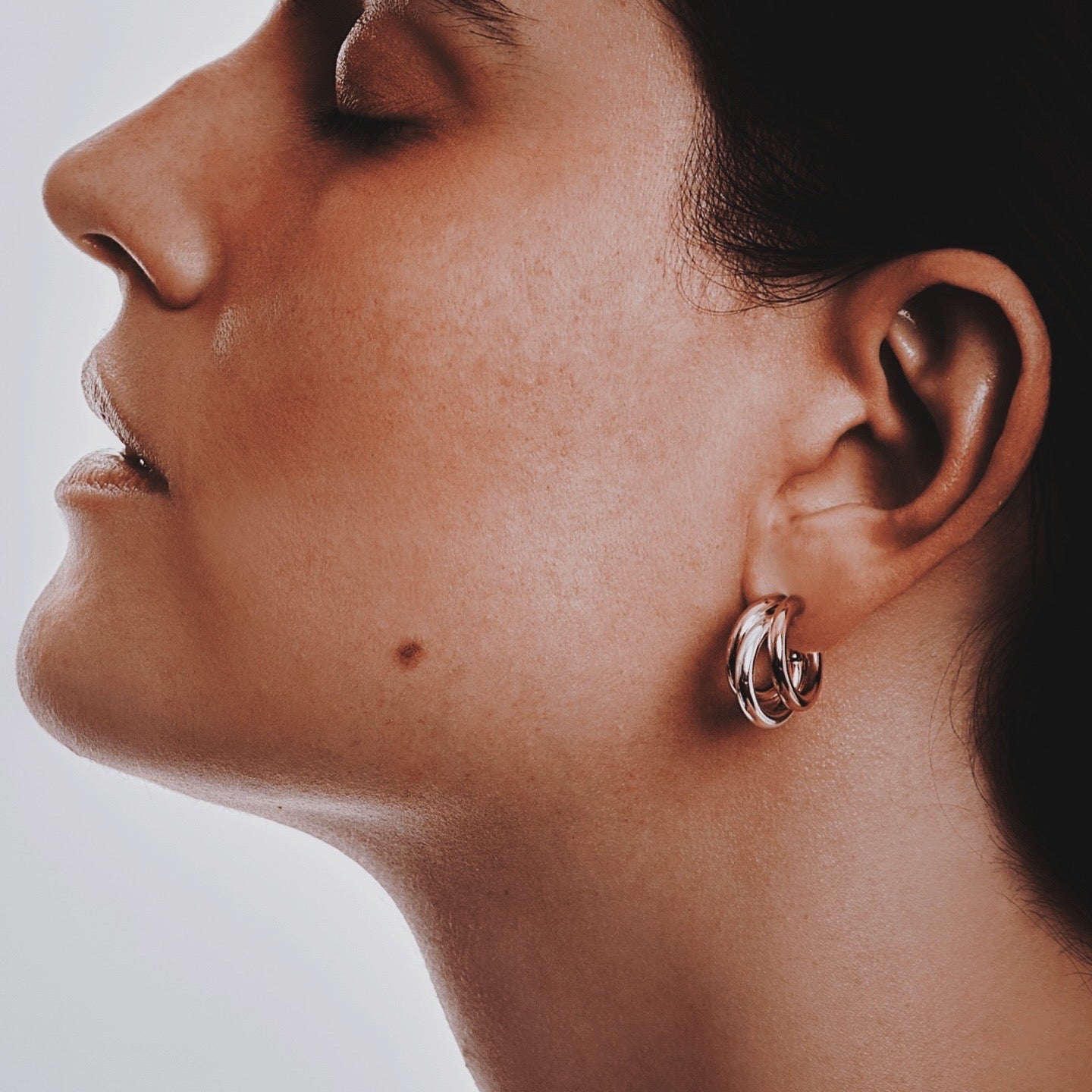 Candice mini hoop earring in gold and silver sculptural mixed-metal jewelry by Luiza Jewelry