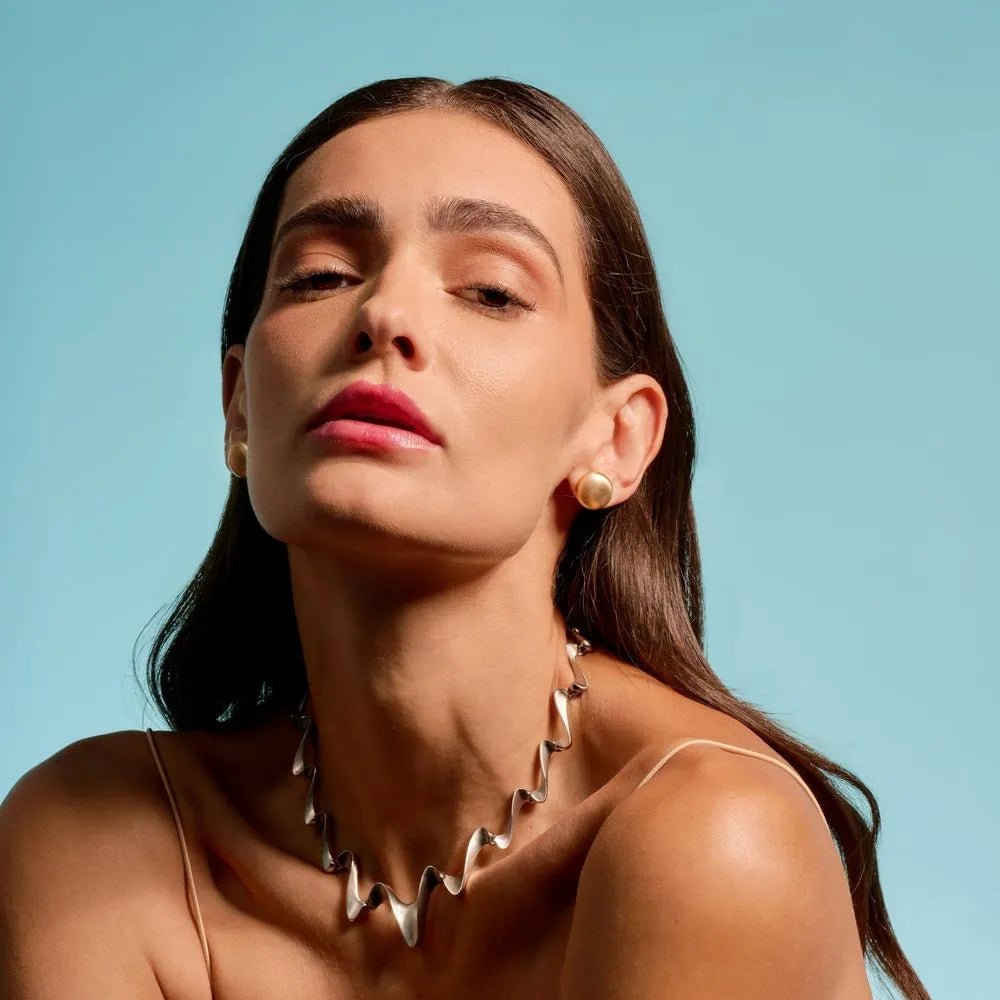 Krystal wavy gold plated choker necklace with ripple design
Krystal - Luiza Jewelry