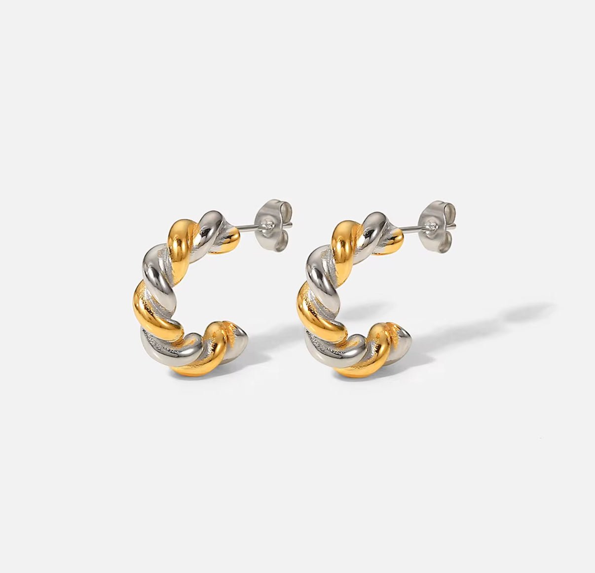 Marcela twisted hoop earring in gold and silver compact mixed-metal jewelry handcrafted in Brazil
