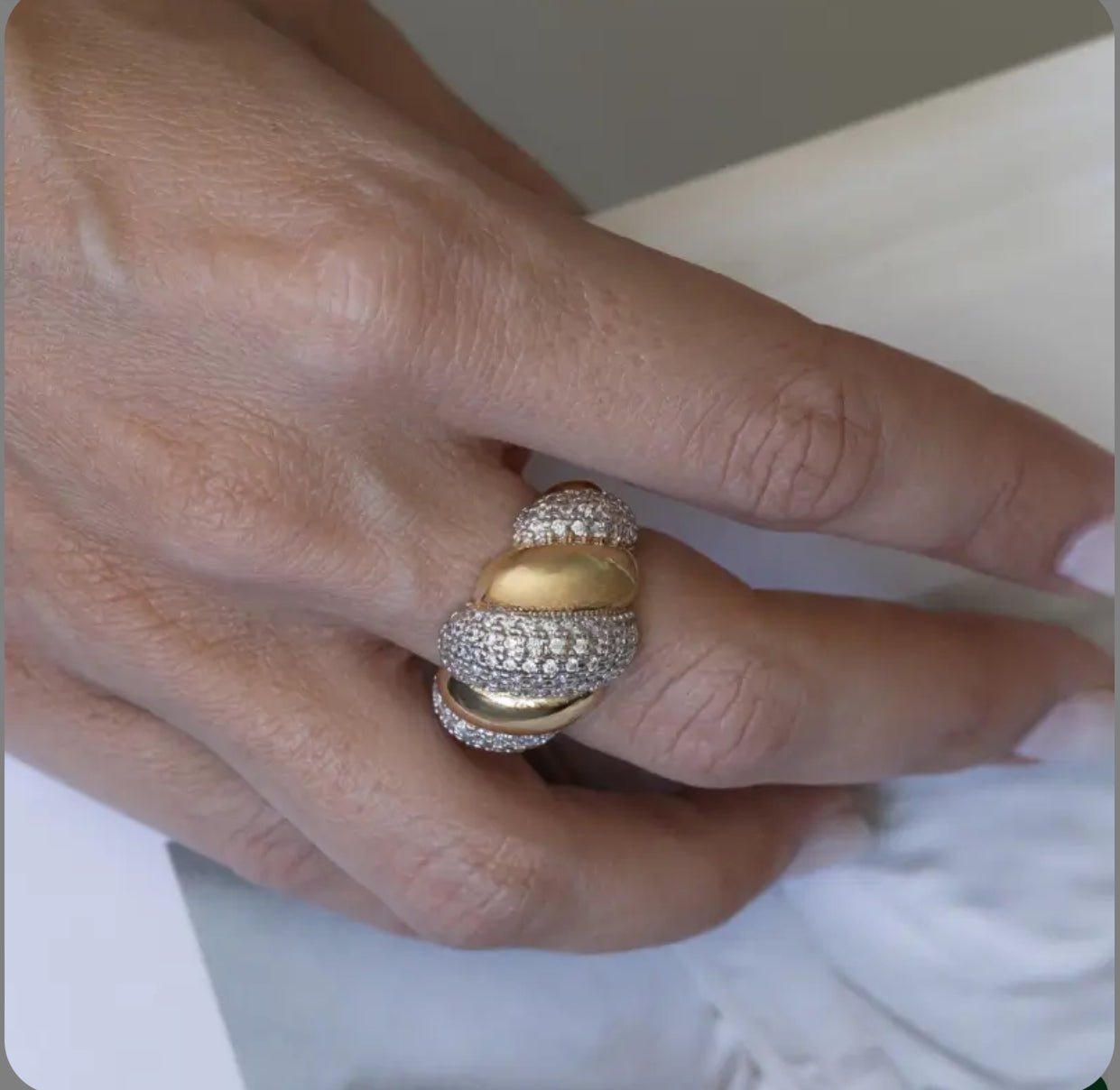 Dora mixed-metal gold and zirconia statement ring on hand – size 7