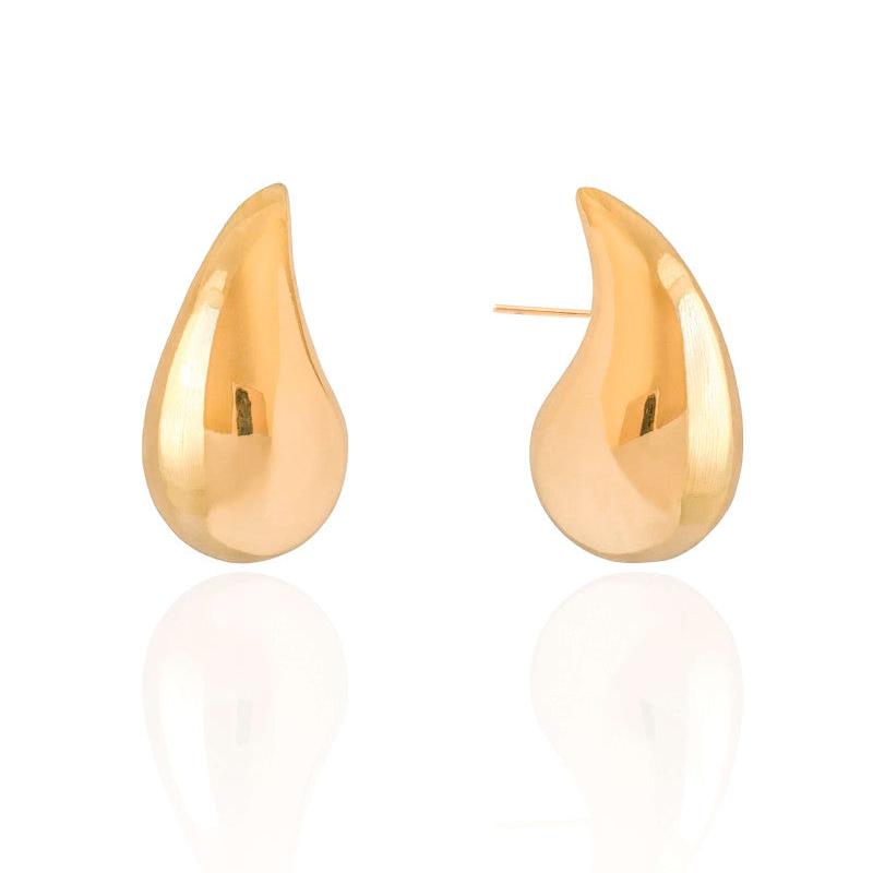 Bold gold sculptural drop earrings with organic curves – Pamela earring by Luiza Jewelry