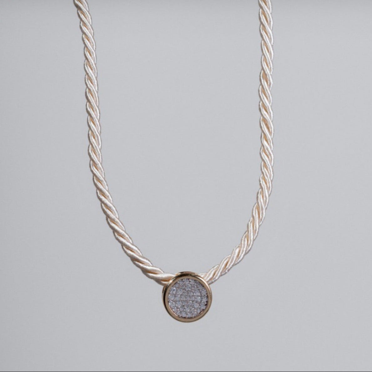 Josephine cord necklace with pavé zircon round pendant in gold finish